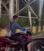 Hyderabad Man Spotted Working on Laptop While Riding Bike in Hitec City, Sparks Safety Concerns